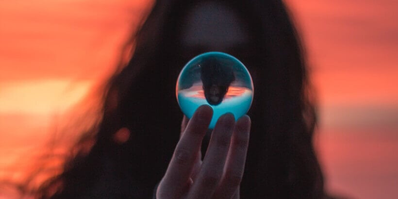 woman holding glass ball