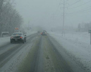 cars driving in snow